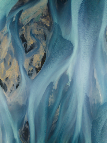 Aerial view of glacial rivers carve paths through Iceland s stark landscape a mesmerizing dance of icy blues and dark earth tones creating an ethereal otherworldly scene Iceland Iceland. Aerial view of glacial rivers carve paths through Iceland s stark landscape a mesmerizing dance of icy blues and dark earth tones creating an ethereal otherworldly scene Iceland Iceland.