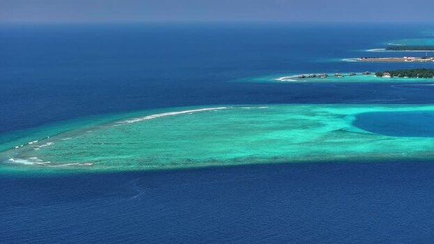 Aerial view of turquoise coral reefs and tropical islands Maldives. Aerial view of turquoise coral reefs and tropical islands Maldives.