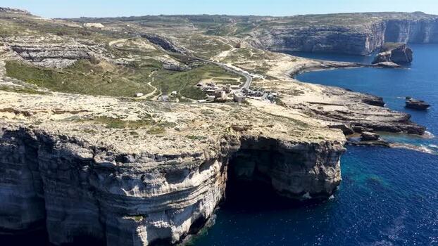 Aerial view of Dwejra Bay cliffs and sea cave in Gozo Malta. Aerial view of Dwejra Bay cliffs and sea cave in Gozo Malta.