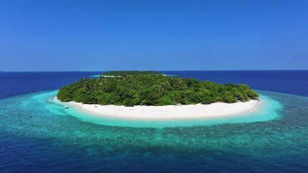 Aerial view of a tropical island with white sand and coral reefs Maldives. Aerial view of a tropical island with white sand and coral reefs Maldives.
