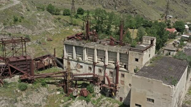 Aerial view of abandoned factory in Caucasus Mountains Russia.