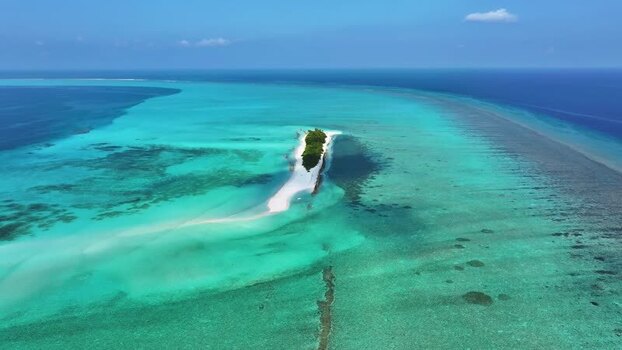 Aerial view of a tropical island with turquoise waters and reefs Maldives. Aerial view of a tropical island with turquoise waters and reefs Maldives.