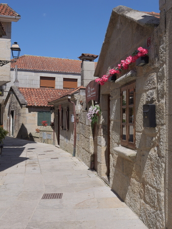 View of the historic stone houses and narrow cobblestone streets in the traditional village of Combarro Pontevedra Spain.
