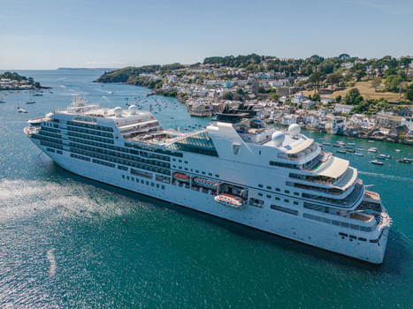 Fowey Cornwall United Kingdom 10 August 2026 Aerial view of a cruise ship in the Fowey river with the historic town and small boats visible in the background. Fowey Cornwall United Kingdom 10 August 2026 Aerial view of a cruise ship in the Fowey river with the historic town and small boats visible in the background.