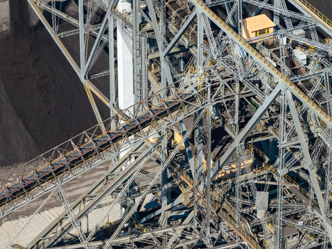 Aerial view of Tagebau Welzow Sud brown coal open pit mine showing complex steel conveyor structures and industrial machinery in Spremberg Brandenburg Germany. Aerial view of Tagebau Welzow Sud brown coal open pit mine showing complex steel conveyor structures and industrial machinery in Spremberg Brandenburg Germany.