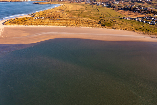 Aerial view of Sheephaven Bay featuring sandy beach dunes and coastal landscape in Dunfanaghy County Donegal Ireland. Aerial view of Sheephaven Bay featuring sandy beach dunes and coastal landscape in Dunfanaghy County Donegal Ireland.