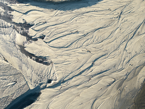 Aerial view of intricate sand textures and water channels in a riverbed in Poland. Aerial view of intricate sand textures and water channels in a riverbed in Poland.