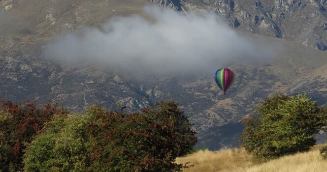View of hot air balloon over mountains New Zealand. View of hot air balloon over mountains New Zealand.