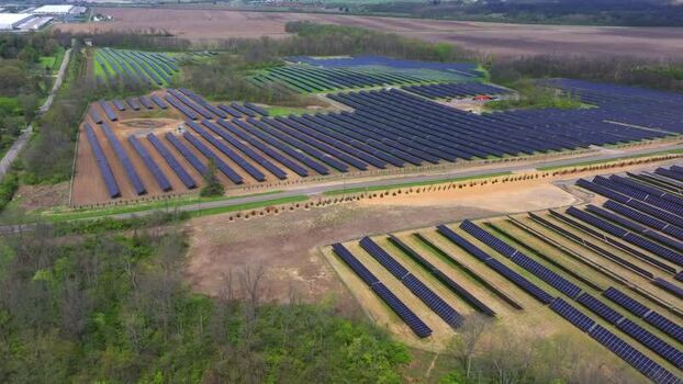 Aerial view of a large solar farm with rows of panels United States. Aerial view of a large solar farm with rows of panels United States.