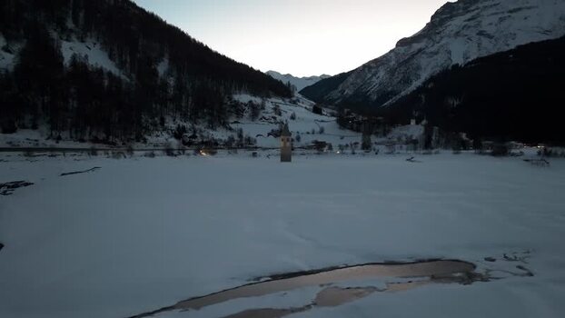 Aerial view of submerged church tower in Graun im Vinschgau Italy. Aerial view of submerged church tower in Graun im Vinschgau Italy.