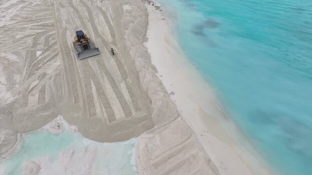 Aerial view of a bulldozer working on a beach in Gulhi Maldives.