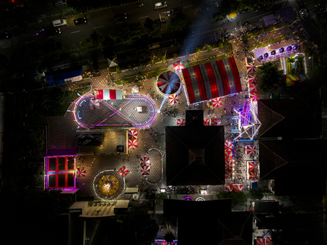 Aerial view of GOR Gelarsena Klaten Night Market with illuminated amusement rides colorful tents and crowds at night in Kecamatan Klaten Utara Jawa Tengah Indonesia. Aerial view of GOR Gelarsena Klaten Night Market with illuminated amusement rides colorful tents and crowds at night in Kecamatan Klaten Utara Jawa Tengah Indonesia.