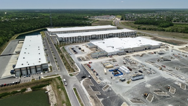 Aerial view of the industrial warehouse complex at Saint Johns Parkway and International Golf Parkway with white rooftops in World Golf Village Florida United States. Aerial view of the industrial warehouse complex at Saint Johns Parkway and International Golf Parkway with white rooftops in World Golf Village Florida United States.
