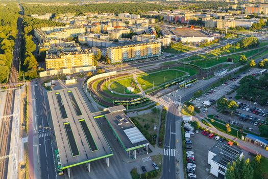 Aerial view of Jana III Sobieskiego Bus and Tram Terminal with transit infrastructure tram tracks residential buildings and parking areas in Poznan Greater Poland Voivod Poland. Aerial view of Jana III Sobieskiego Bus and Tram Terminal with transit infrastructure tram tracks residential buildings and parking areas in Poznan Greater Poland Voivod Poland.