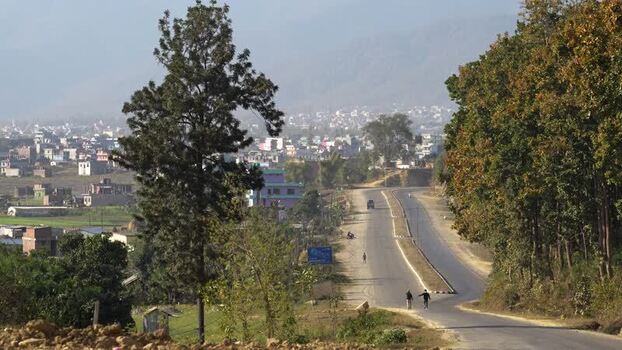 View of people walking on the road towards Surkhet city Nepal.