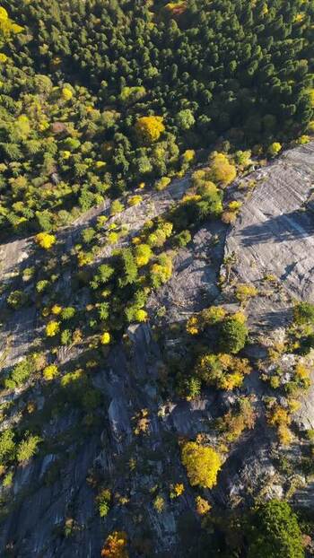 Aerial view of Val di Mello granite cliffs in autumn Italy. Aerial view of Val di Mello granite cliffs in autumn Italy.