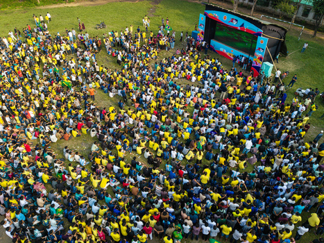 Dhaka Bangladesh 20 June 2026 Aerial view of Dhaka University Campus with a large crowd of people gathered on the grass to watch a sports match on a large outdoor screen. Dhaka Bangladesh 20 June 2026 Aerial view of Dhaka University Campus with a large crowd of people gathered on the grass to watch a sports match on a large outdoor screen.