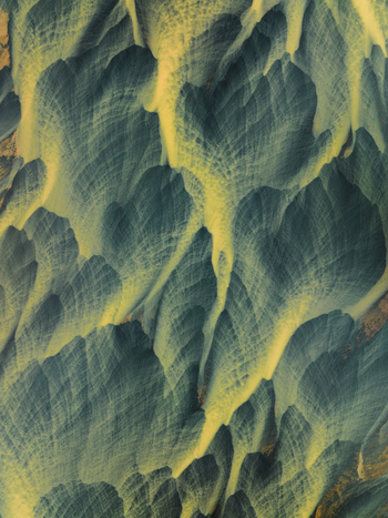 Aerial view of braided river patterns carve through the stark landscape a symphony of ochre and azure creating an ethereal otherworldly scene Iceland Iceland. Aerial view of braided river patterns carve through the stark landscape a symphony of ochre and azure creating an ethereal otherworldly scene Iceland Iceland.