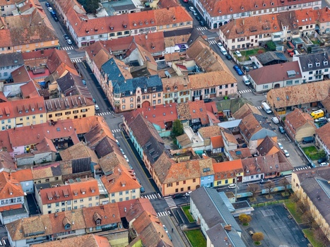 Aerial view of the tightly packed terracotta rooftops and orderly street grid creating a mesmerizing tapestry of urban life Neuf Brisach Grand Est France.