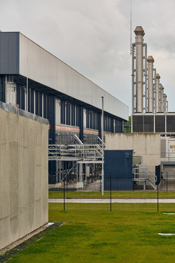 Middenmeer Netherlands 17 May 2026 View of the Microsoft datacenters western europe on Agriport with industrial cooling stacks and concrete walls under an overcast sky.