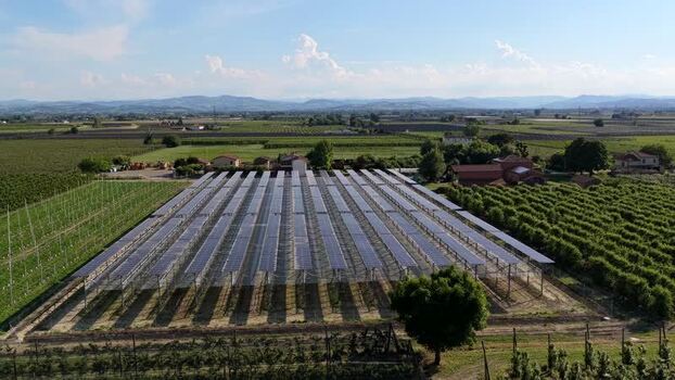 Aerial view of solar farm in rural fields Italy.