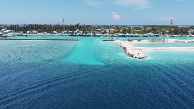 Aerial view of Kudahuvadhoo island harbor and lagoon Maldives.