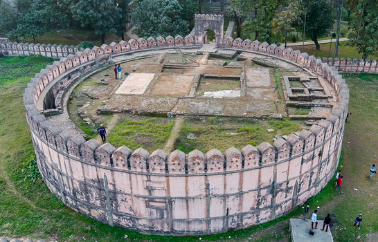 Aerial view of the ancient circular Idrakpur Fort with its weathered walls and inner ruins standing as a testament to history Munshiganj Dhaka Division Bangladesh. Aerial view of the ancient circular Idrakpur Fort with its weathered walls and inner ruins standing as a testament to history Munshiganj Dhaka Division Bangladesh.