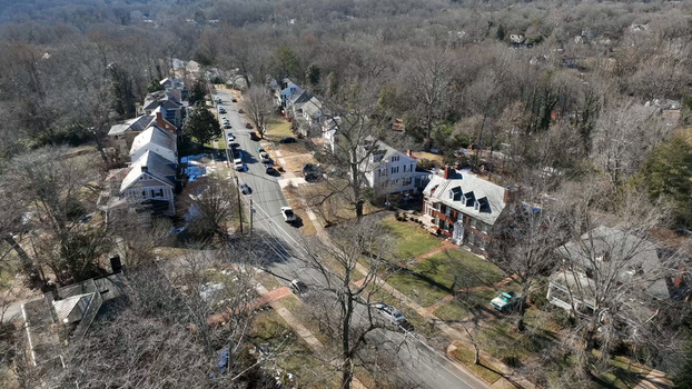 Aerial view of a quiet residential street with historic houses bare trees and parked cars in Lynchburg Virginia United States. Aerial view of a quiet residential street with historic houses bare trees and parked cars in Lynchburg Virginia United States.