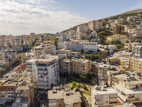 Aerial view of the coastal city of Saranda with dense residential buildings and urban infrastructure in Saranda Vlore County Albania. Aerial view of the coastal city of Saranda with dense residential buildings and urban infrastructure in Saranda Vlore County Albania.