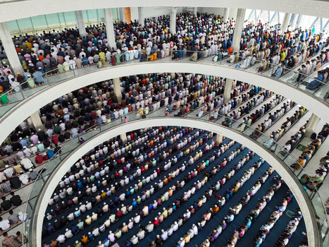 Dhaka Bangladesh 19 June 2026 Aerial view of a large crowd of men praying inside a multi level mosque.