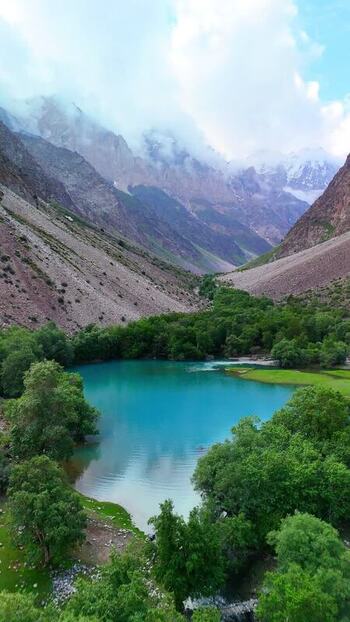 Aerial view of Qullai Vudor and a turquoise lake Tajikistan. Aerial view of Qullai Vudor and a turquoise lake Tajikistan.