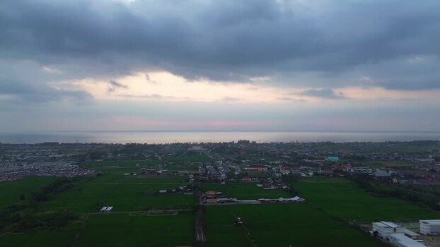 Aerial view of Mataram city and rice fields in Indonesia.