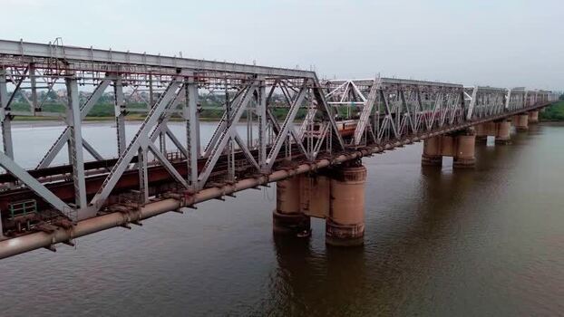 Aerial view of train on Narmada bridge India.