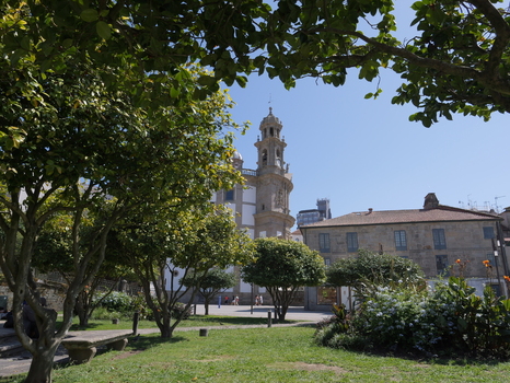 View of the Santuario de la Virgen Peregrina framed by lush green trees in a park setting in Pontevedra Pontevedra Spain.