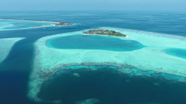 Aerial view of tropical islands and coral reefs in Maldives. Aerial view of tropical islands and coral reefs in Maldives.