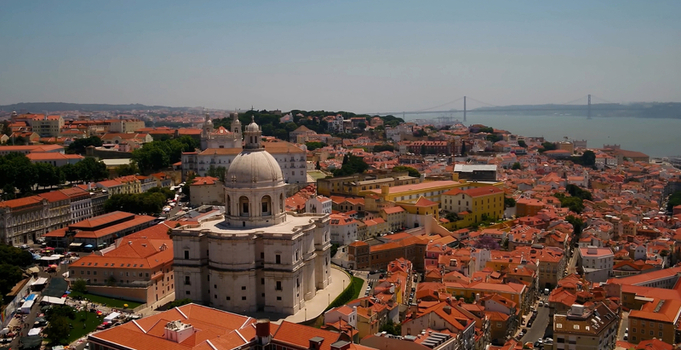 Aerial view of the National Pantheon surrounded by historic red tiled rooftops and urban architecture in Lisboa Lisboa Portugal. Aerial view of the National Pantheon surrounded by historic red tiled rooftops and urban architecture in Lisboa Lisboa Portugal.
