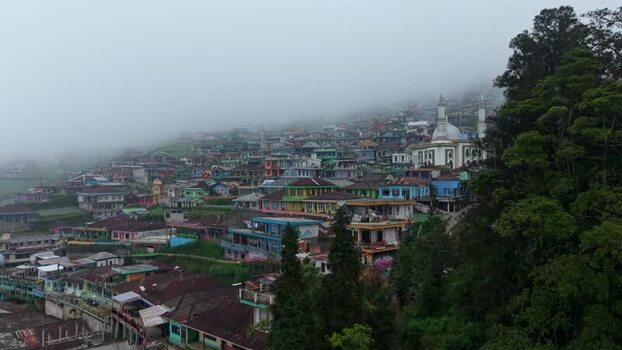 Aerial view of Nepal Van Java village on a misty hillside Indonesia.