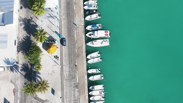 Aerial view of boats docked at a harbor in Kudahuvadhoo Maldives. Aerial view of boats docked at a harbor in Kudahuvadhoo Maldives.