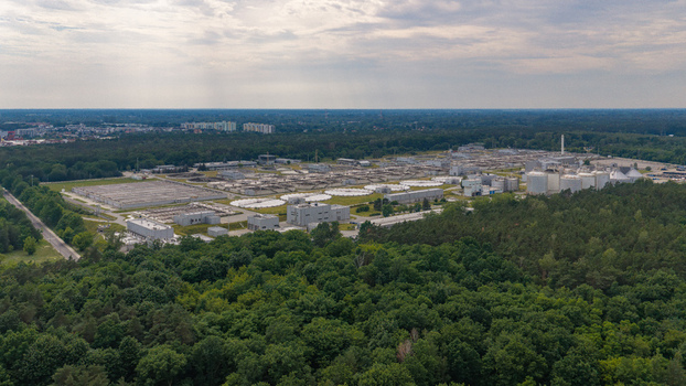 Aerial view of the wastewater treatment plant surrounded by lush green forests and industrial infrastructure in Warsaw Masovian Voivodeship Poland. Aerial view of the wastewater treatment plant surrounded by lush green forests and industrial infrastructure in Warsaw Masovian Voivodeship Poland.