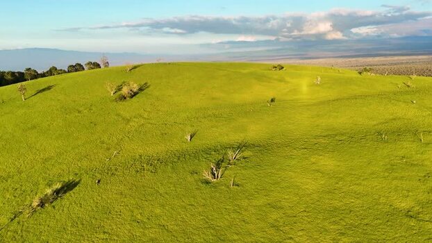 Aerial view of Puu Waawaa cinder cone and lush green hills United States. Aerial view of Puu Waawaa cinder cone and lush green hills United States.
