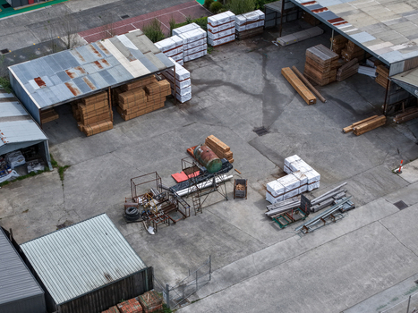 Melbourne VIC Australia 25 September 2026 Aerial view of a lumber yard with stacks of timber industrial machinery and factory sheds.