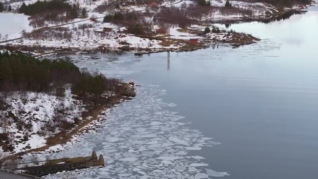 Aerial view of snowy Lofoten coastline Norway.