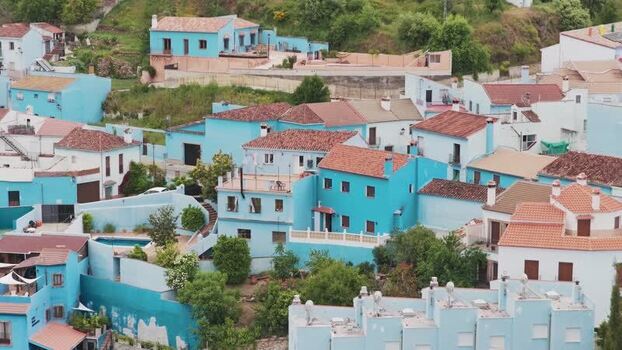 Aerial view of the blue houses of Juzcar Spain.