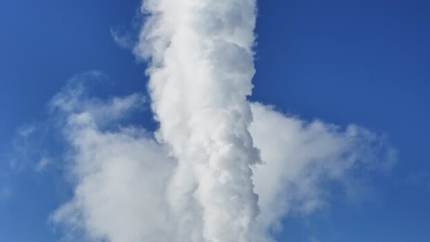 Aerial view of a white smoke plume rising in the sky Austria.