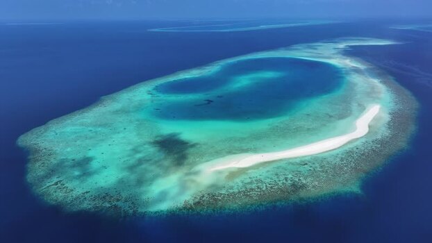 Aerial view of a tropical coral atoll and turquoise lagoon Maldives. Aerial view of a tropical coral atoll and turquoise lagoon Maldives.