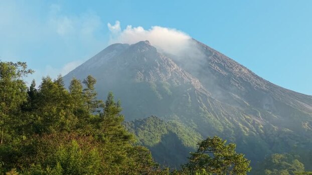 Aerial view of Mount Merapi with smoking crater Indonesia.
