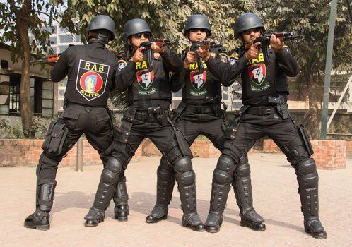 Dhaka Bangladesh 06 January 2017 View of members of the Rapid Action Battalion Elite Force in tactical gear holding rifles at the RAB Headquarters. Dhaka Bangladesh 06 January 2017 View of members of the Rapid Action Battalion Elite Force in tactical gear holding rifles at the RAB Headquarters.