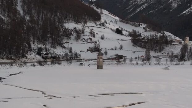 Aerial view of the submerged bell tower in Reschensee Italy. Aerial view of the submerged bell tower in Reschensee Italy.