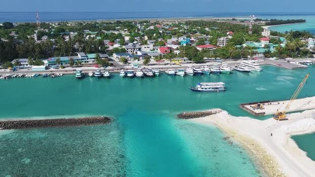 Aerial view of boats in the harbor of Kudahuvadhoo Maldives. Aerial view of boats in the harbor of Kudahuvadhoo Maldives.