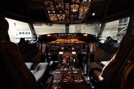 View of the illuminated cockpit of a Boeing 737 800 aircraft with detailed flight instruments and controls at Langenhagen Niedersachsen Germany. View of the illuminated cockpit of a Boeing 737 800 aircraft with detailed flight instruments and controls at Langenhagen Niedersachsen Germany.